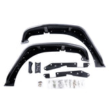 A pair of front black aluminum fender flares for Jeep Wranglers, including front flares, mounting brackets, and installation hardware. The kit features pre-drilled holes for easy installation and includes bolts, washers, and screws neatly packaged in plastic bags. The fender flares are powder-coated for durability and designed to withstand tough off-road conditions, offering both functionality and style.