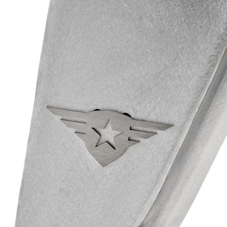 Close-up view of a raw aluminum rear fender flare for a Jeep Wrangler, showcasing the natural metal finish and the removable, paintable Combat Off Road logo near the edge. The image also highlights pre-drilled holes for easy installation, emphasizing durability and customization for off-road use.