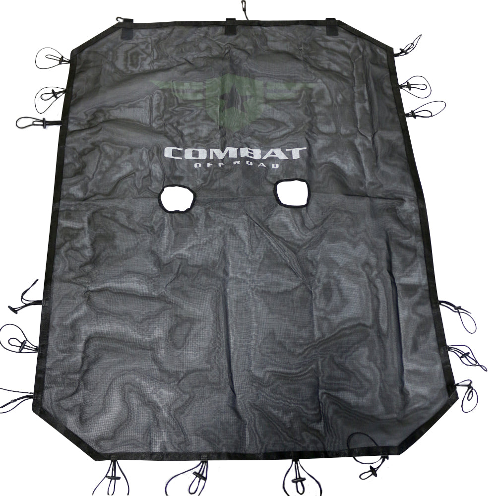 Black mesh sunshade for a 4-door Jeep JK, designed to reduce sunlight exposure while maintaining airflow. Features the Combat Off Road logo prominently displayed in white with a subtle green backing at the center. The sunshade has two cutouts for the front seat area and is equipped with durable bungee cords along the edges for secure attachment to the Jeep's roll bars. The shade's material is lightweight and sturdy, suitable for off-road adventures.